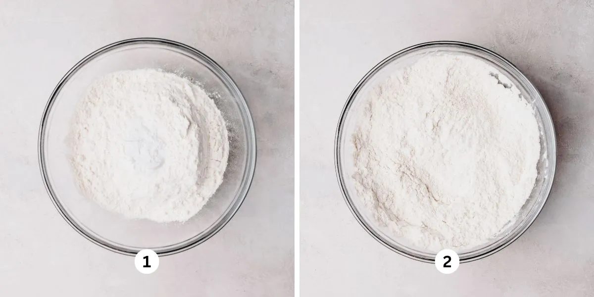 Whisking coffee cake dry ingredients together in a glass bowl on a white background.
