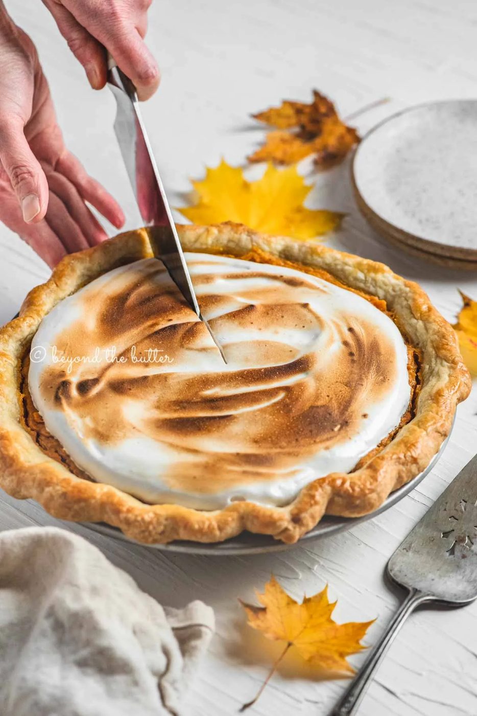 Cutting into the brown sugar sweet potato pie with pie server, plates, and napkin around it | | All Images © Sovuh