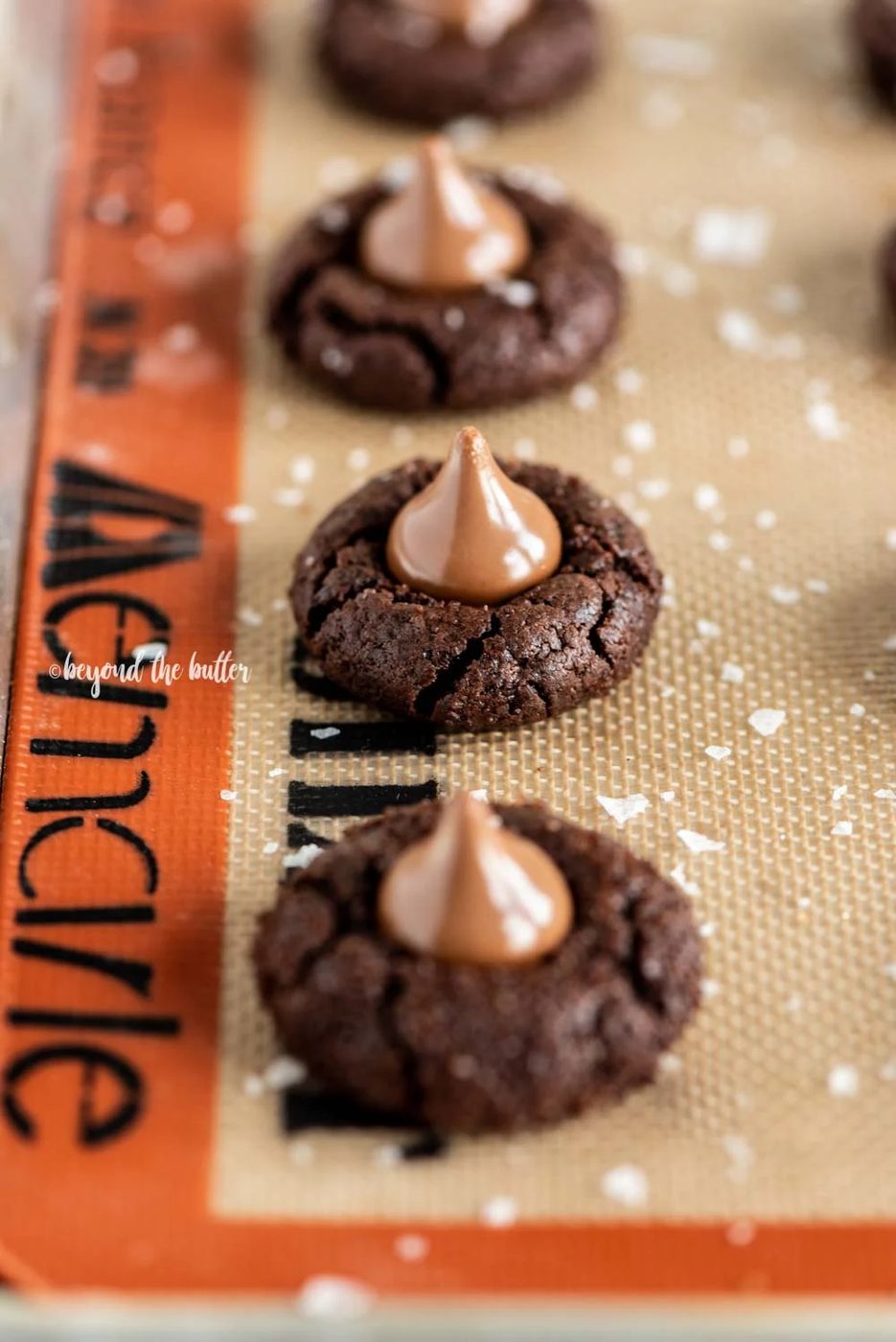 Angled image of Chocolate Caramel Blossoms on cookie sheet | All Images © Sovuh, LLC