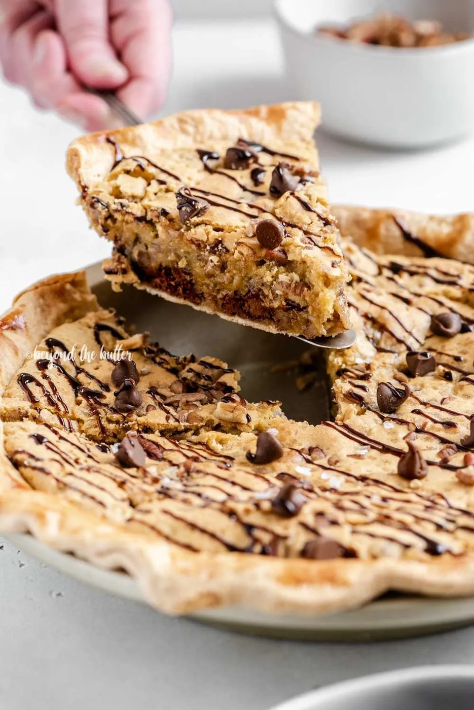 Closeup image of slice of chocolate chip pie being served | All Images © Sovuh
