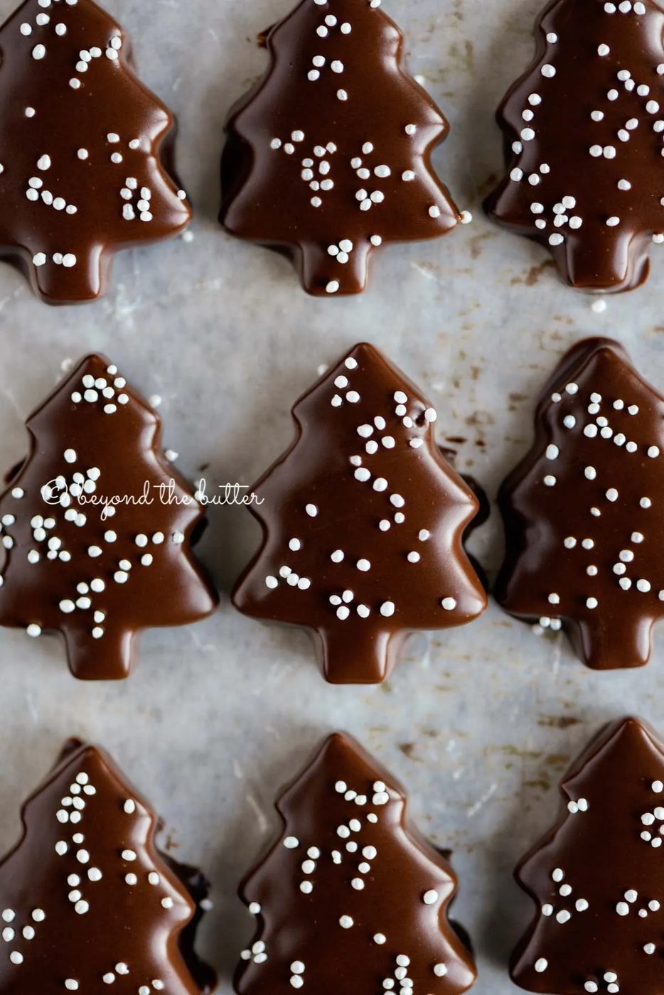 Chocolate Dipped Graham Cracker Chrismtas Trees on a cookie sheet | © Sovuh