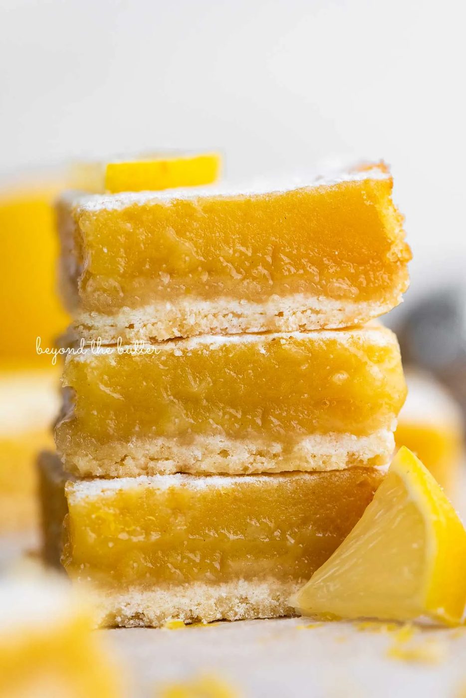Stack of three lemon bars on white background | © Sovuh