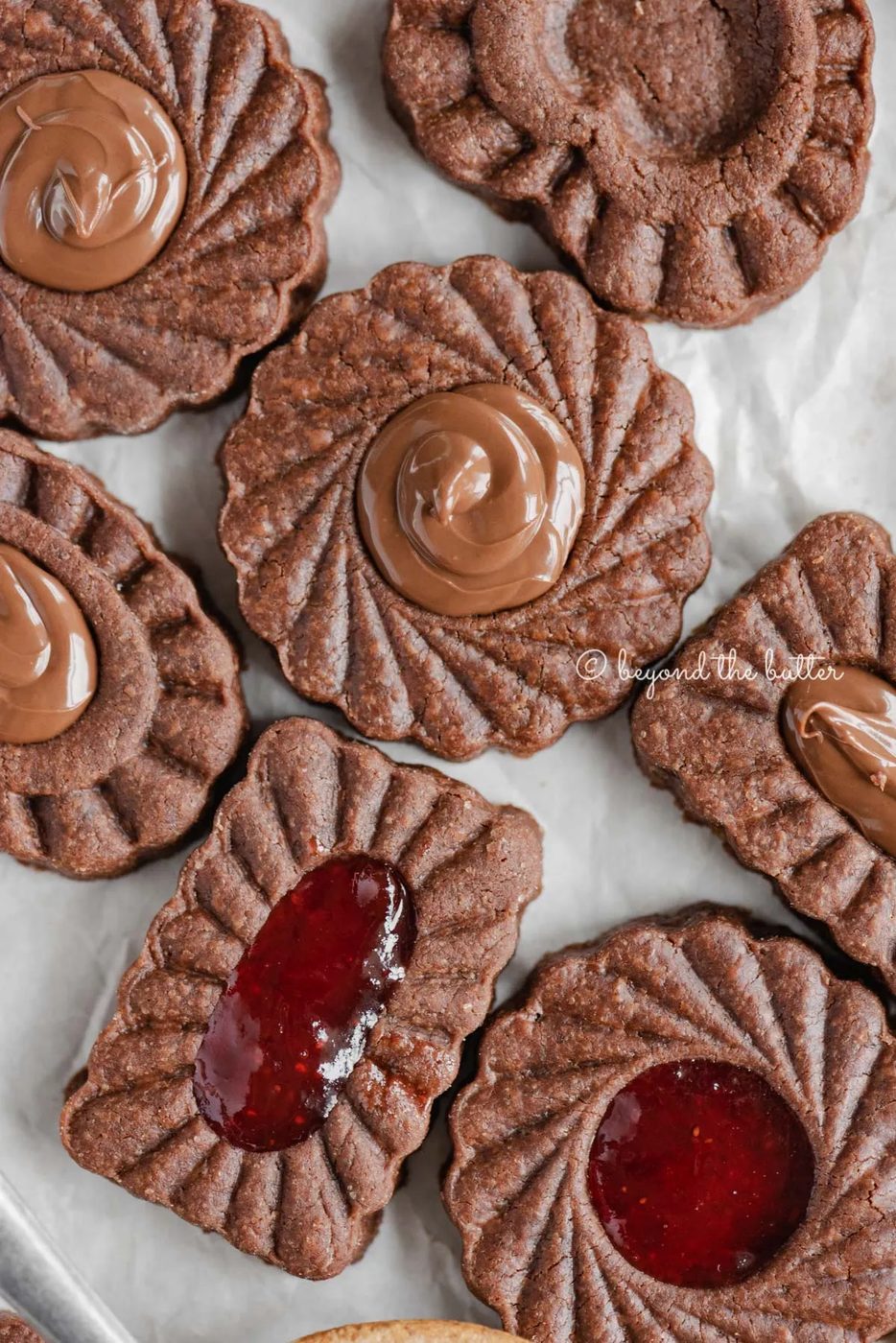 Closeup image of chocolate thumbprint cookies | All Images © Sovuh