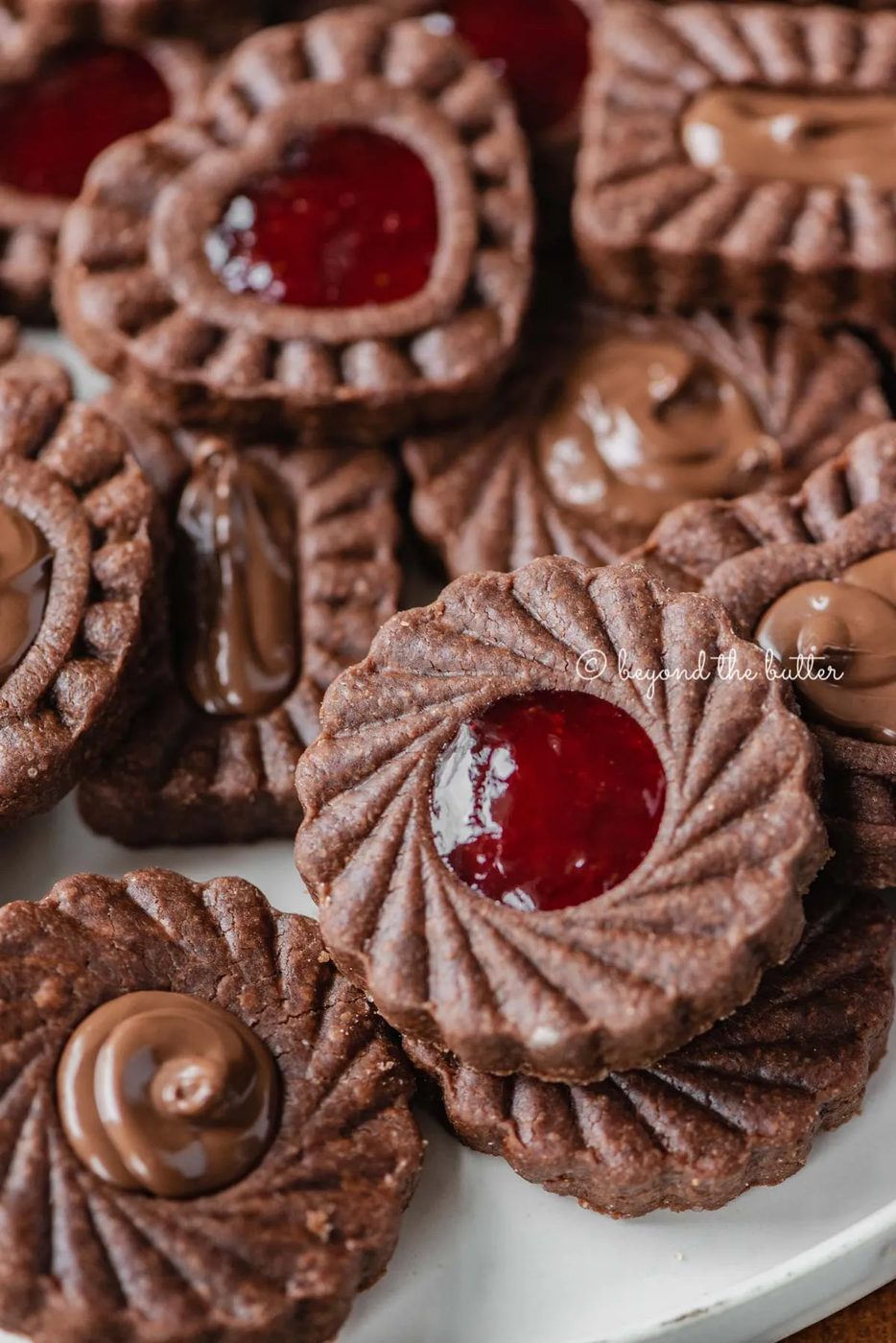 Closeup image of chocolate thumbprint cookies | All Images © Sovuh
