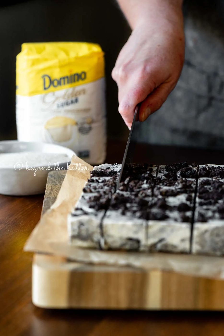 Cutting the cookies and cream fudge with small bag of Domino Golden Sugar in the background | All Images © Sovuh