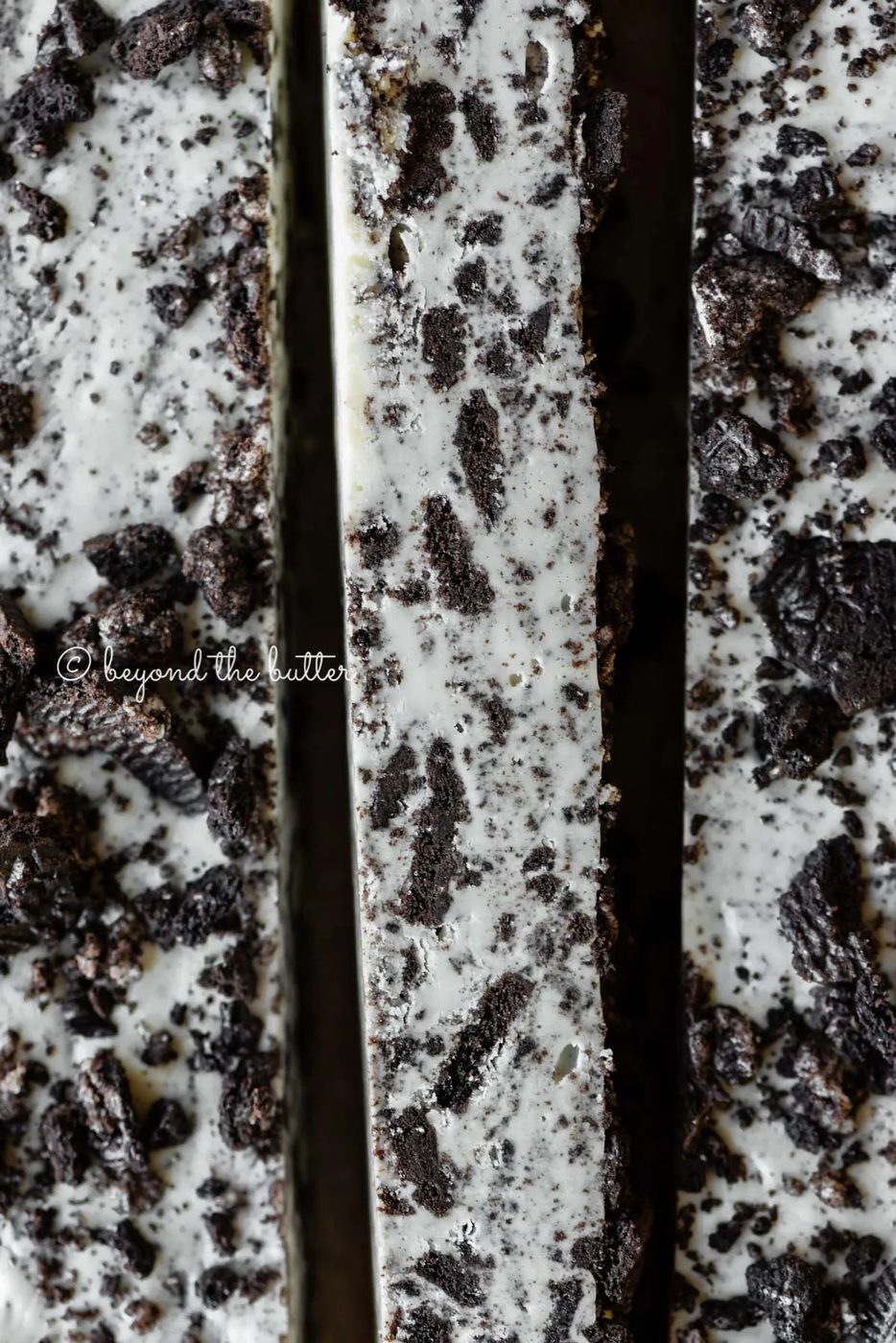 Bars of cookies and cream fudge on brown parchment paper | All Images © Sovuh