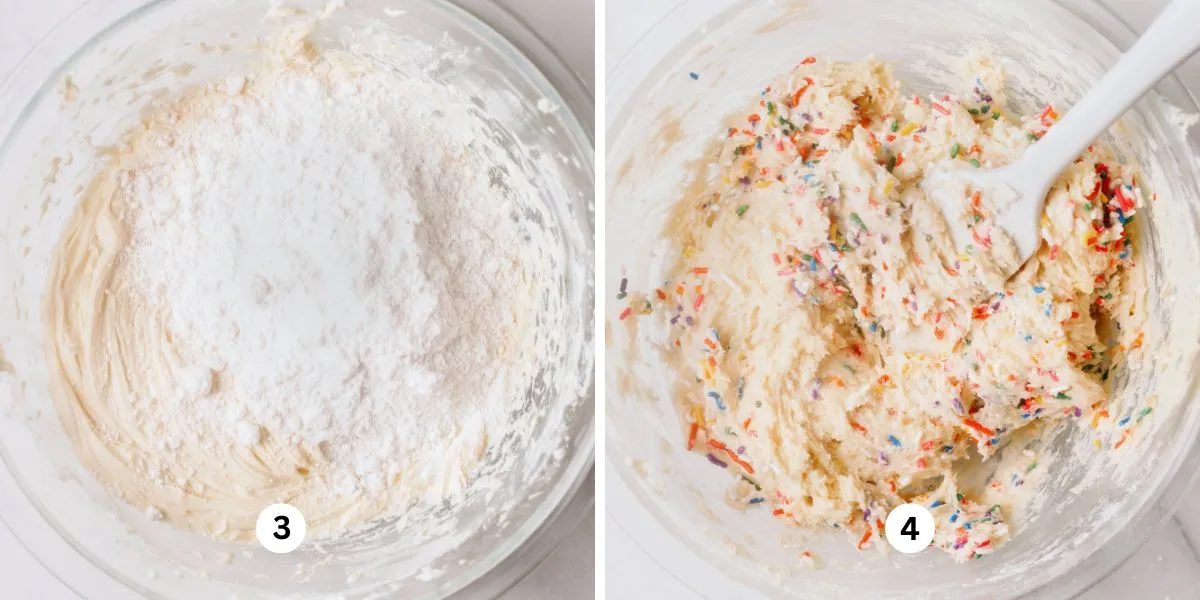 Adding white cake mix and sprinkles to funfetti cookie dough using a white spatula in a large glass mixing bowl on a white background.
