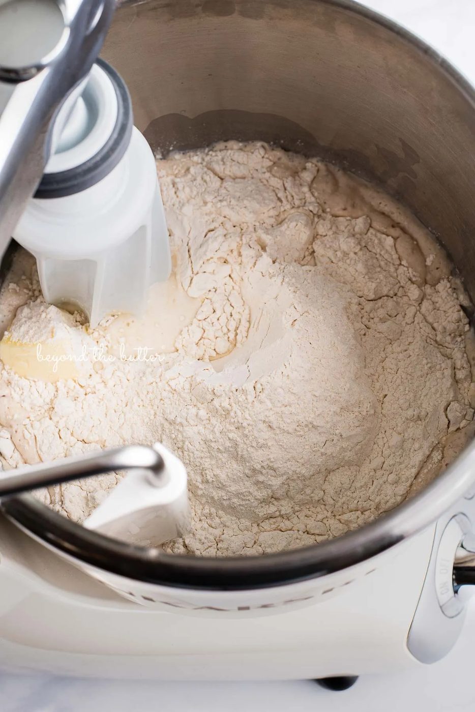 Ankarsrum original mixer filled with ingredients to make house-made honey butter dinner rolls | © Sovuh