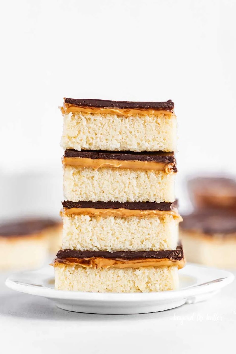 Image of stacked house-made peanut butter kandy kakes on a white dessert plate | All Images © Sovuh