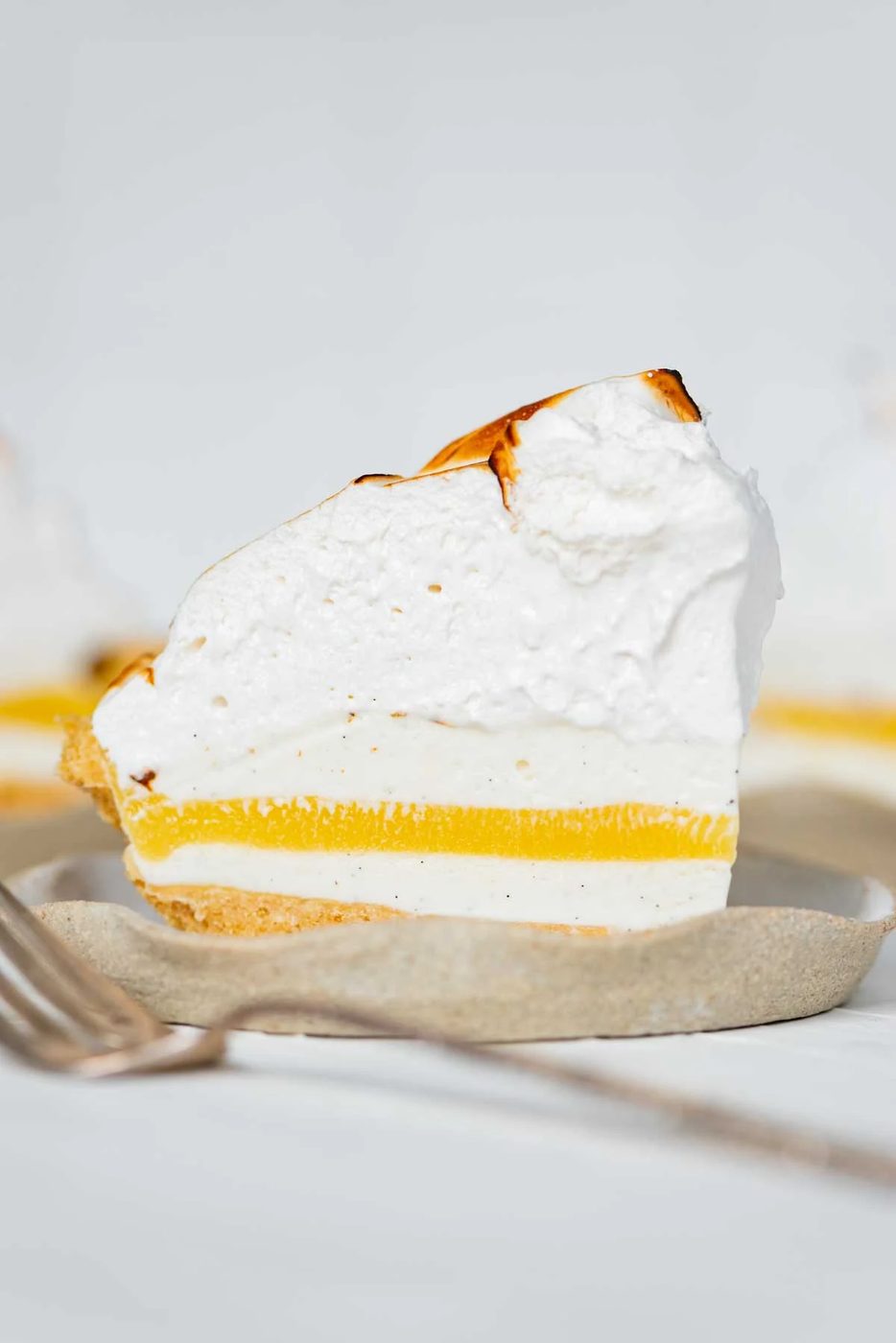 Slices of lemon meringue ice cream pie on dessert plates from Sovuh.com | © Sovuh
