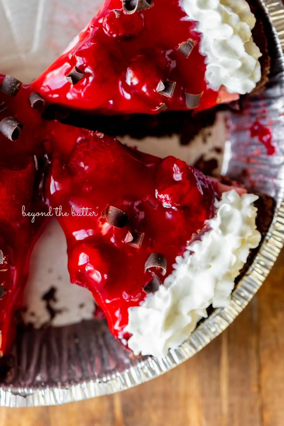 Sliced no bake strawberry chocolate cream pie on wood table | All images © Sovuh