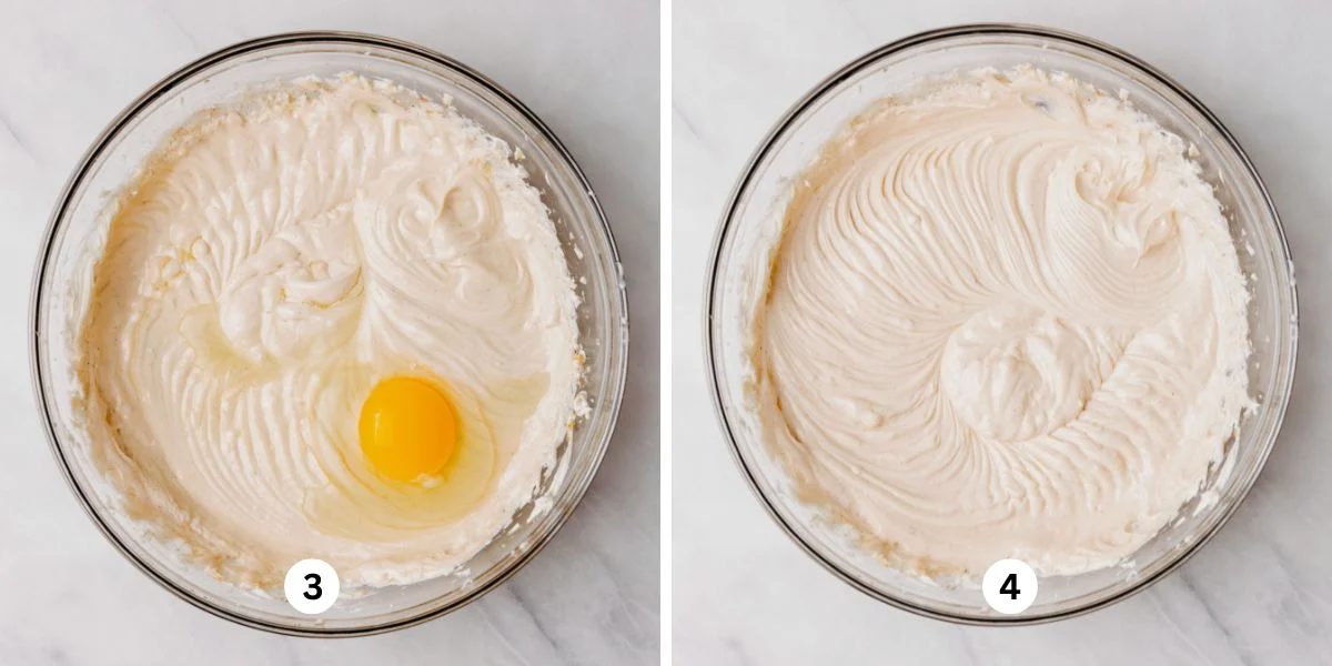 Adding eggs to cheesecake batter in a glass mixing bowl, mixing until each one is fully combined.