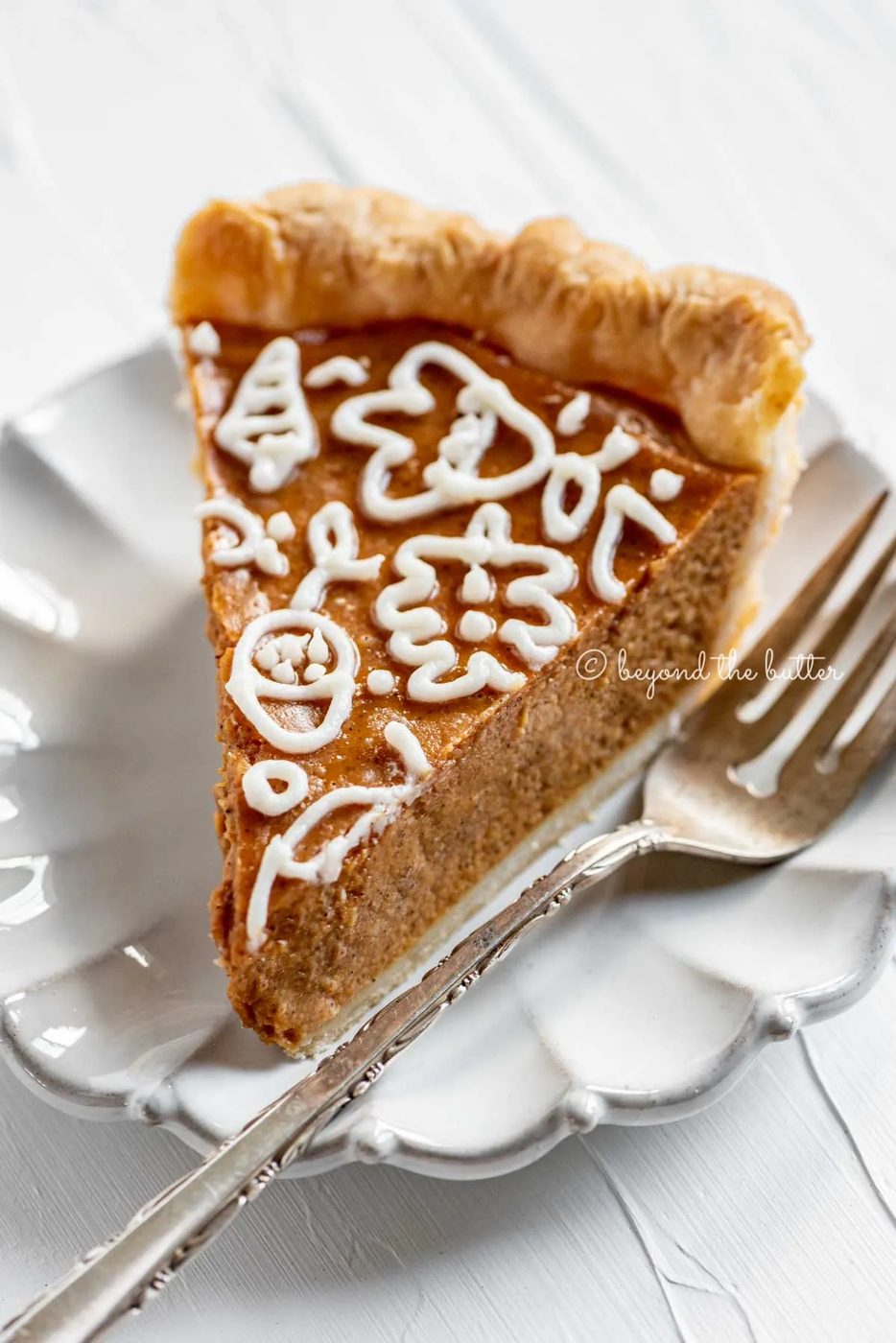 Slice of pumpkin pie on a dessert plate | All Images © Sovuh