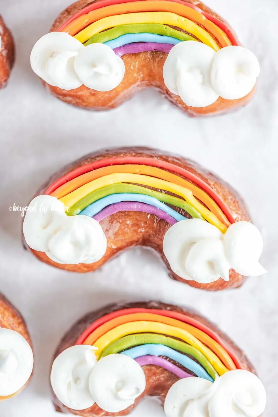 Overhead closeup image of house-made Rainbow Donuts | All Images © Sovuh, LLC