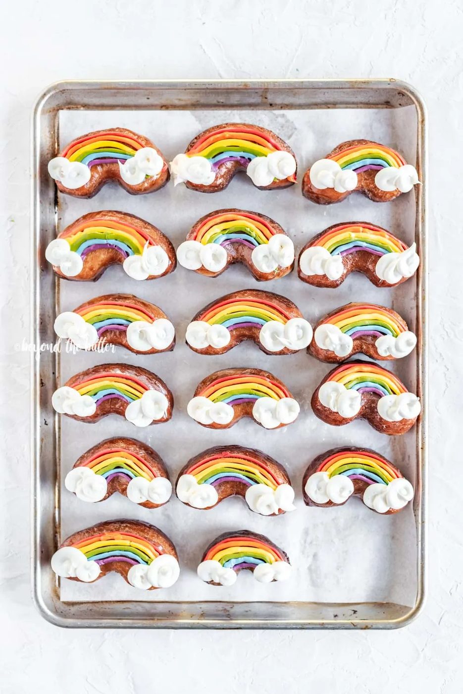 Overhead image of Rainbow Donuts on a baking sheet | All Images © Sovuh, LLC
