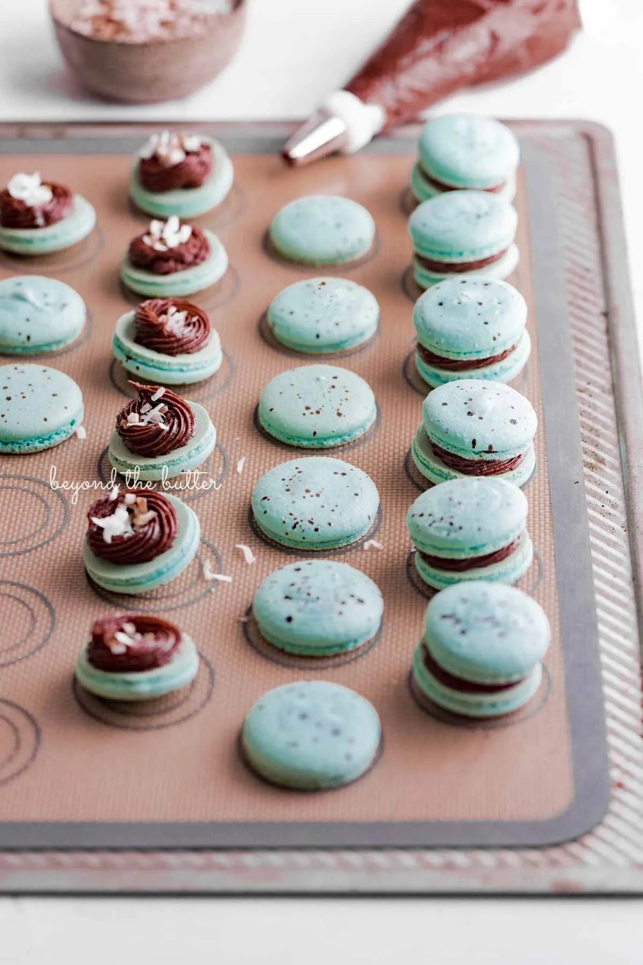 Assembling the robin's egg macarons on a silicone baking mat | All images © Sovuh