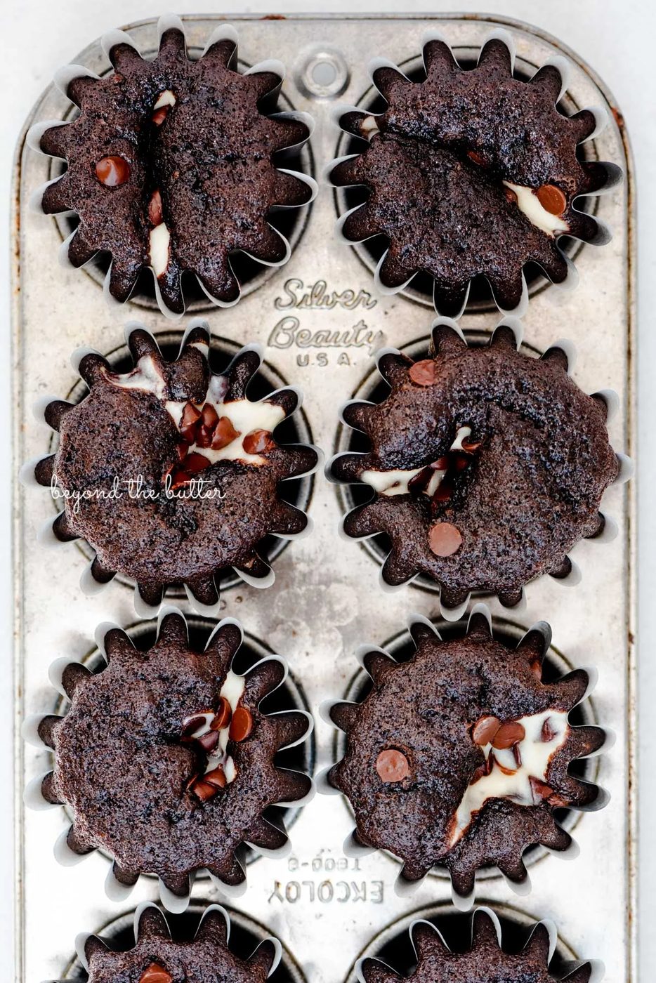 Small batch black bottom cupcakes in a vintage baking tin from Sovuh.com | © Sovuh