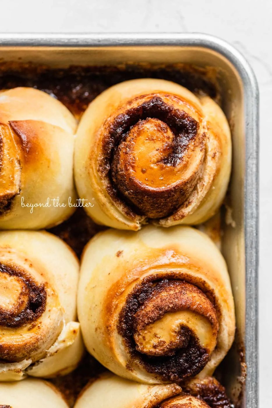 Small batch cinnamon rolls pre-frosted with cream cheese frosting from Sovuh.com | © Sovuh