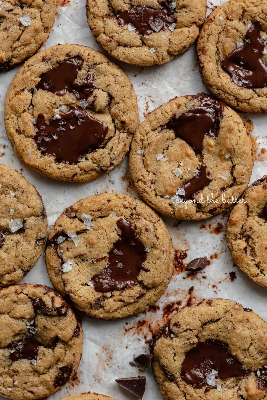 Small batch gluten-free peanut butter chocolate chunk cookies on a parchment paper lined baking sheet | © Sovuh