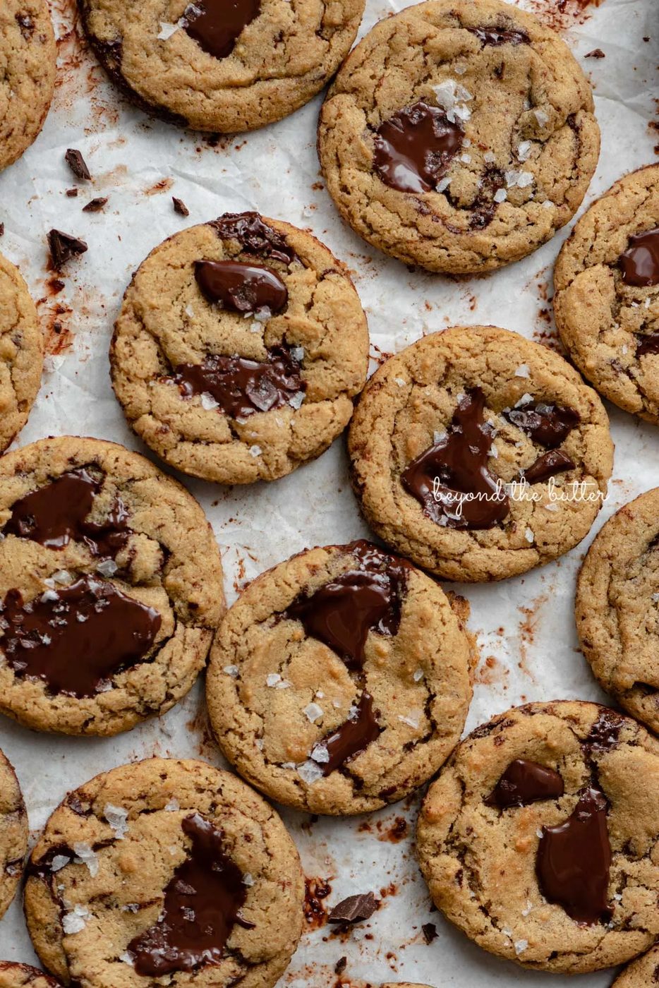 Small batch gluten-free peanut butter chocolate chunk cookies on a parchment paper lined baking sheet | © Sovuh