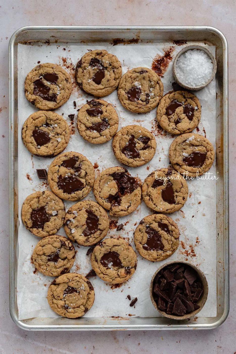 Small batch gluten-free peanut butter chocolate chunk cookies on a parchment paper lined baking sheet | © Sovuh