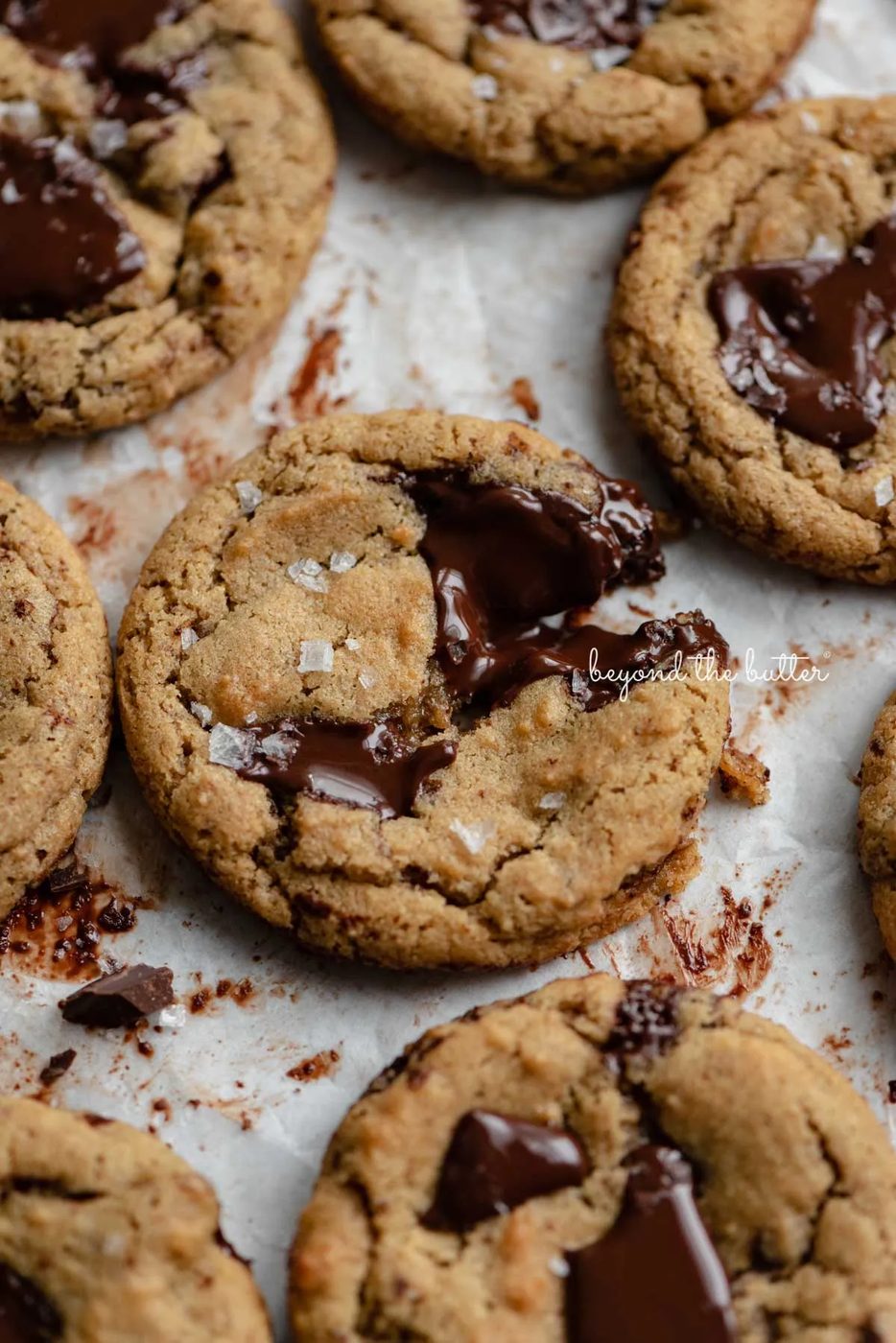 Small batch gluten-free peanut butter chocolate chunk cookies on a parchment paper lined baking sheet | © Sovuh