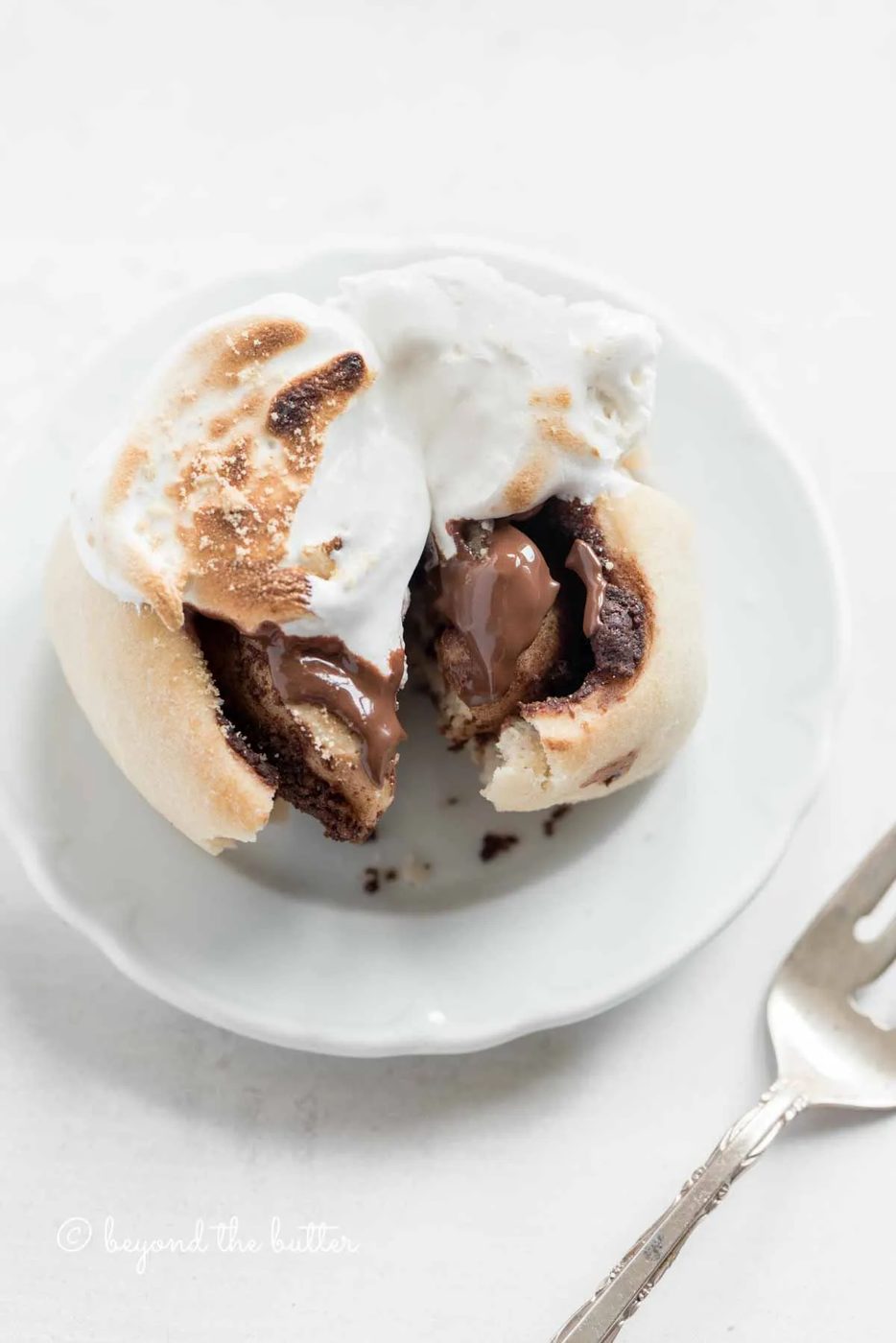 Small plate of pulled apart s'mores roll with silver fork to the side | All Images © Sovuh