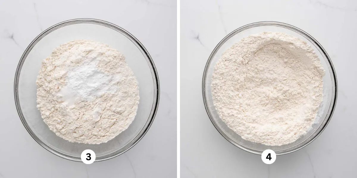 Whisking flour, salt, and baking powder together in a large glass bowl on a white marbled background.