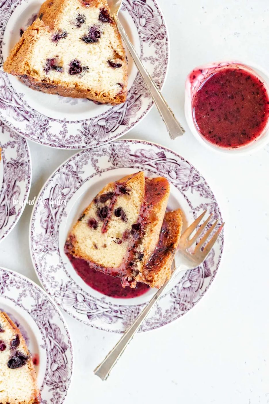 Slices of blueberry bundt cake with blueberry glaze drizzled over the top | All Images © Sovuh, LLC