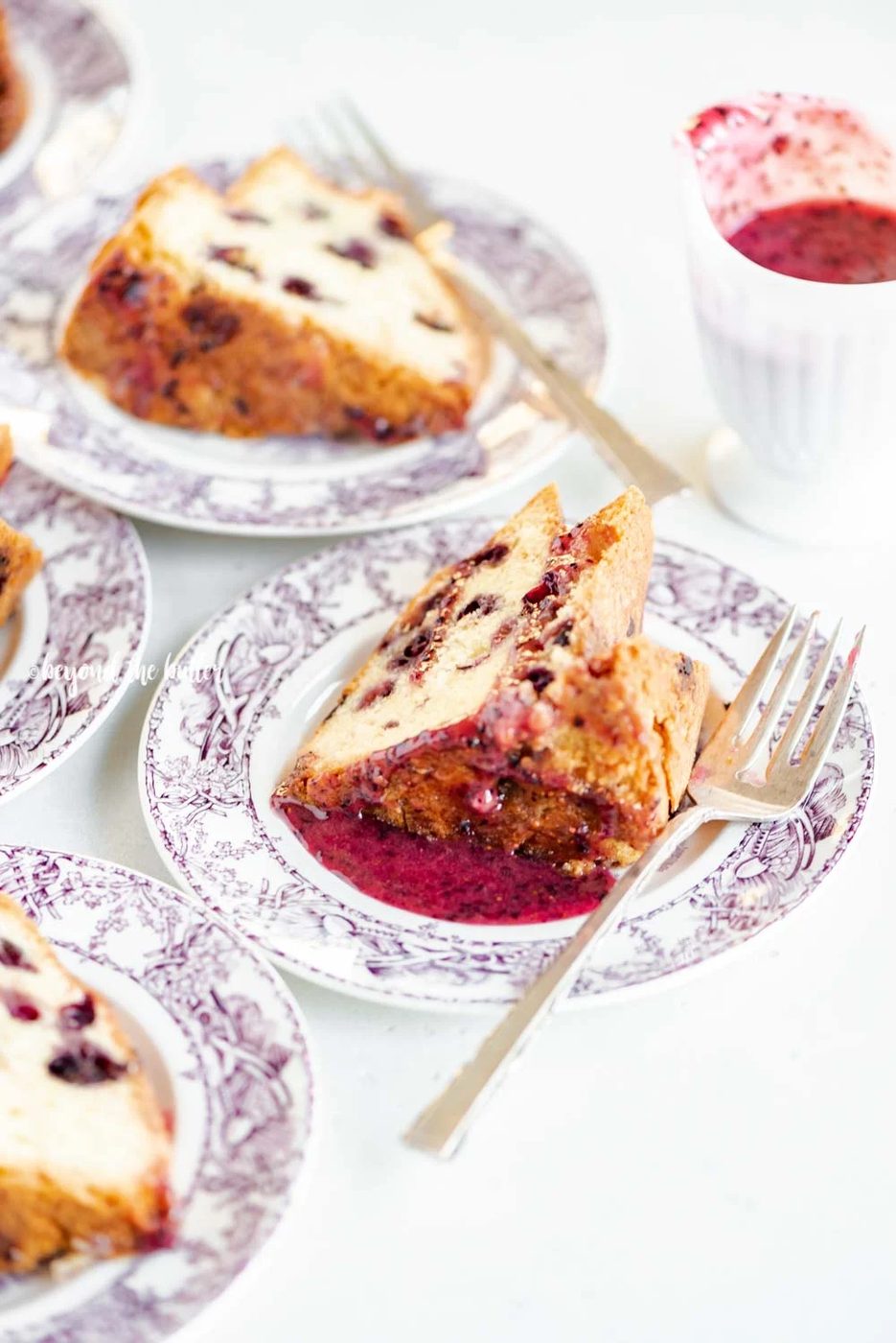 Slices of blueberry bundt cake with blueberry glaze drizzled over the top | All Images © Sovuh, LLC