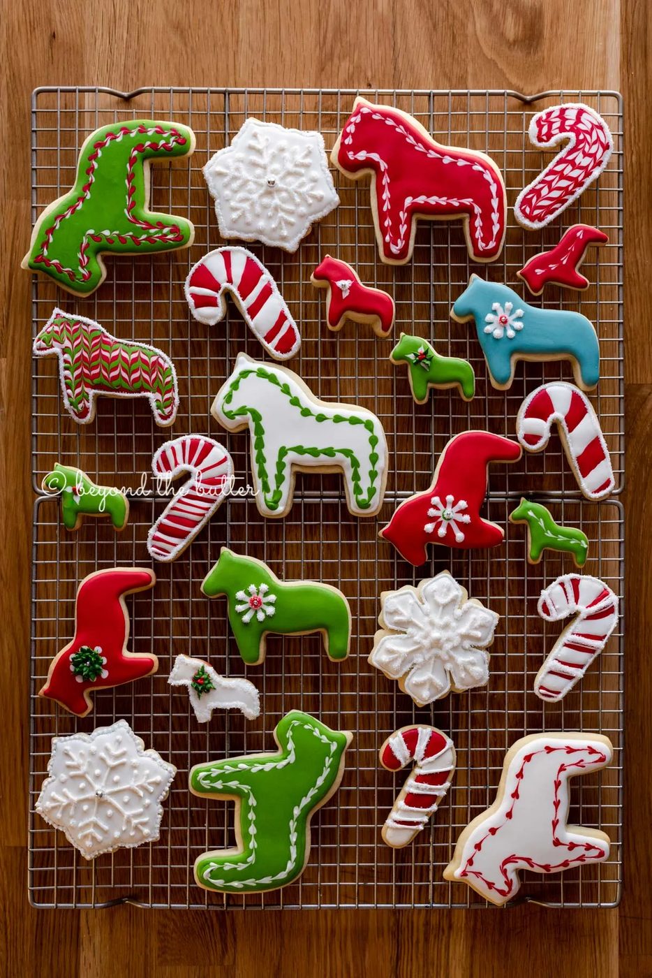 Super soft cut out sugar cookies on a wire cooling rack | All Images © Sovuh