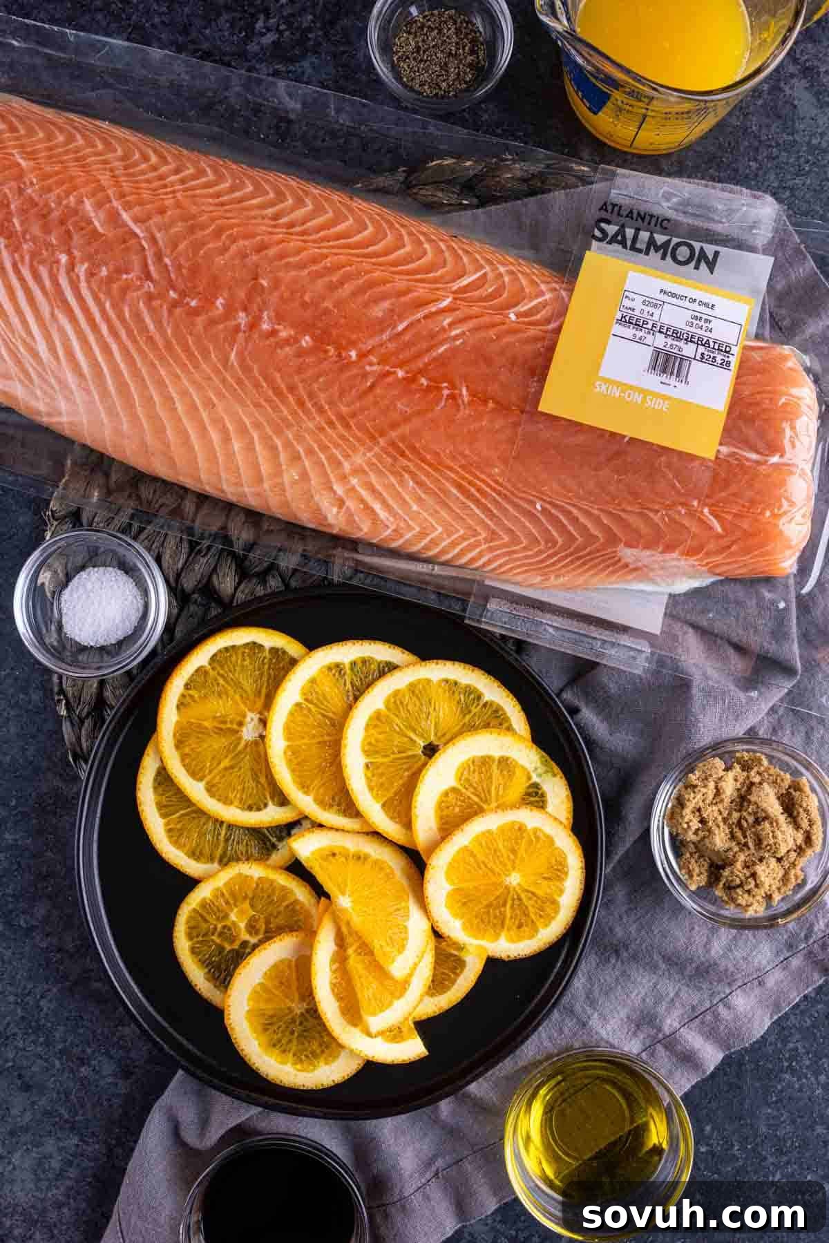 Citrus-Kissed Salmon 3 Fresh salmon fillet with orange slices and seasoning ingredients to make Orange Glazed Salmon