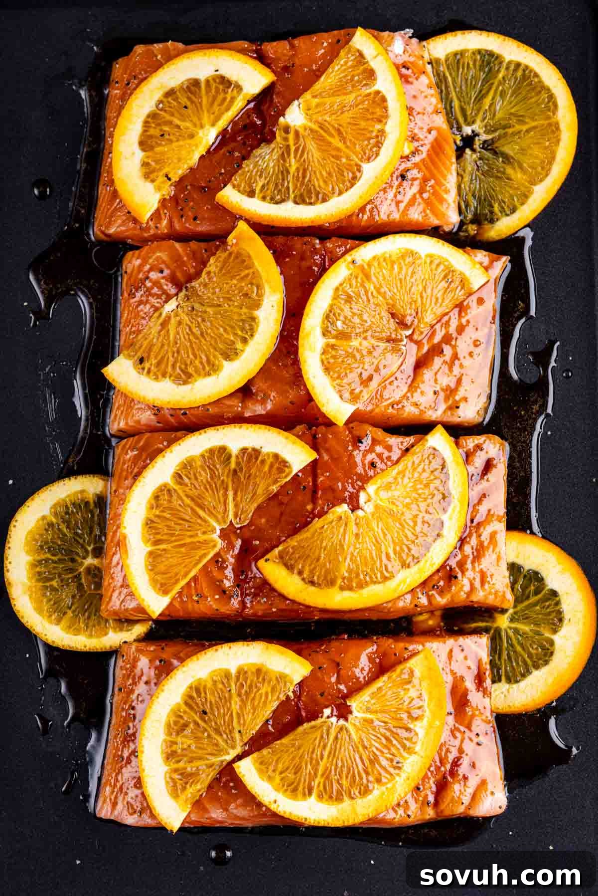 Citrus-Kissed Salmon 6 Orange-glazed salmon fillets ready for cooking.
