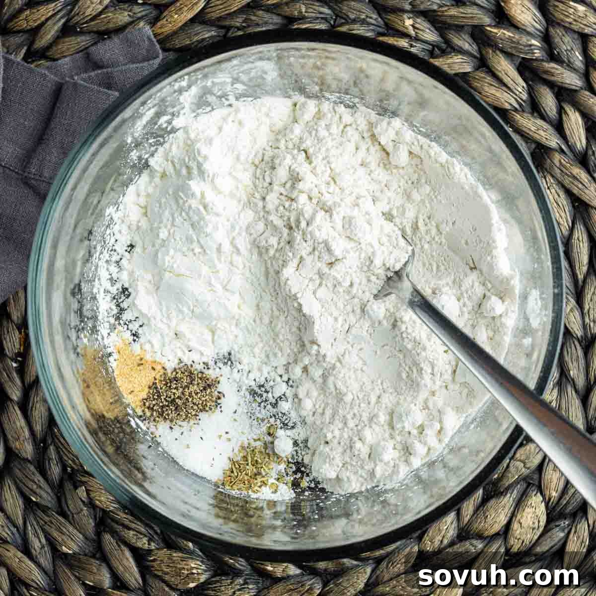 Mixing dry ingredients for zucchini fritte batter.