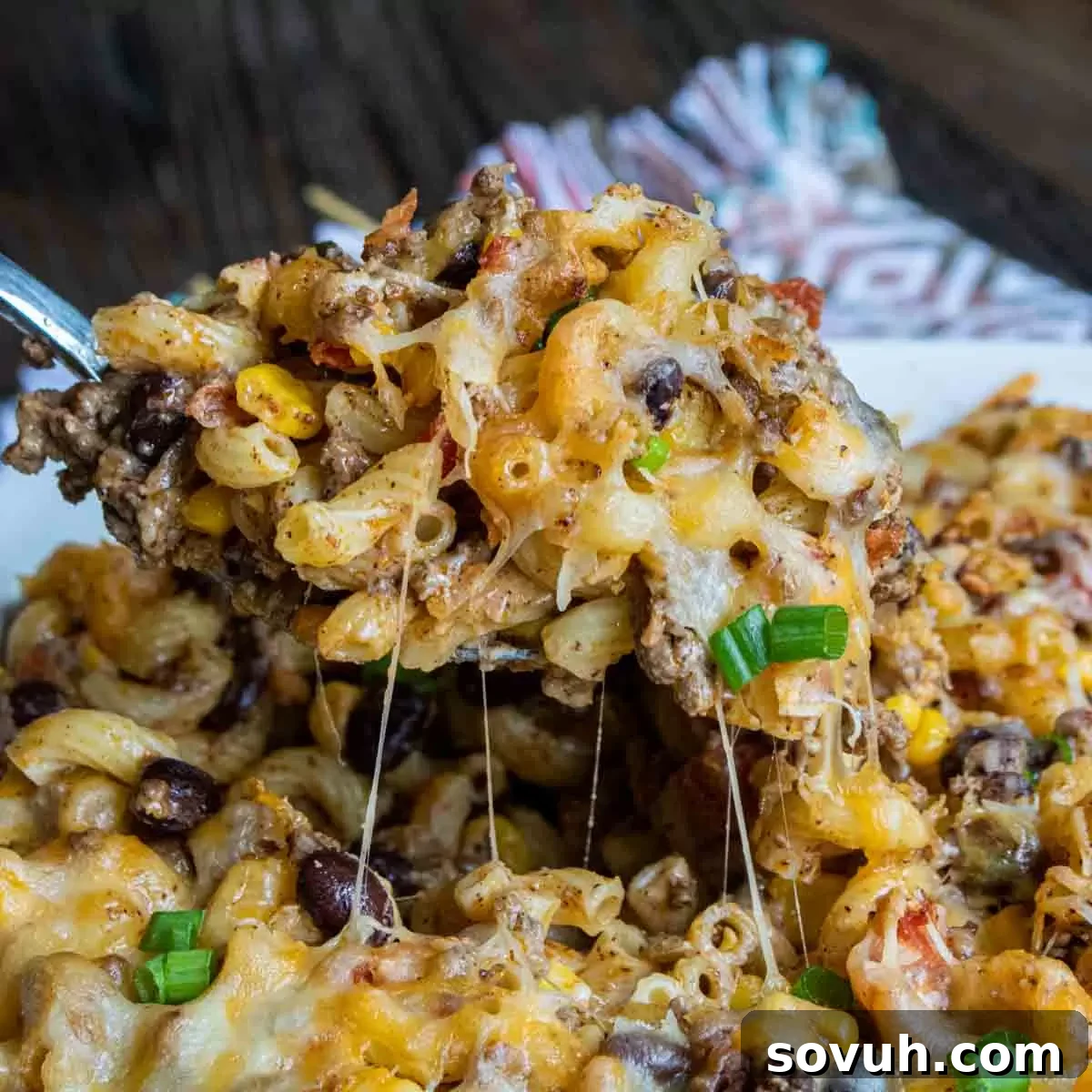 spoon if Taco Mac and Cheese Casserole with beans