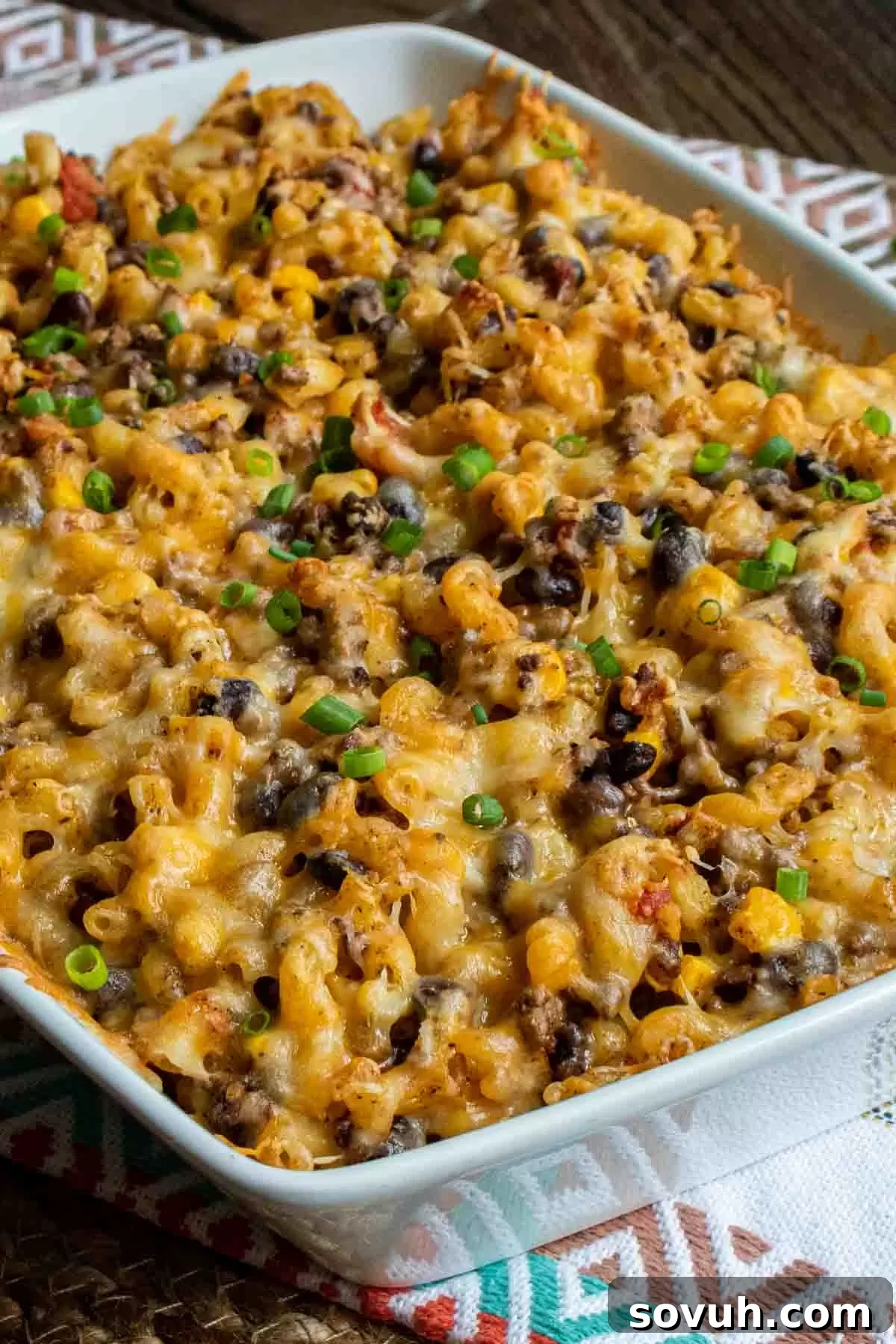 Taco Mac and Cheese Casserole in a white casserole dish