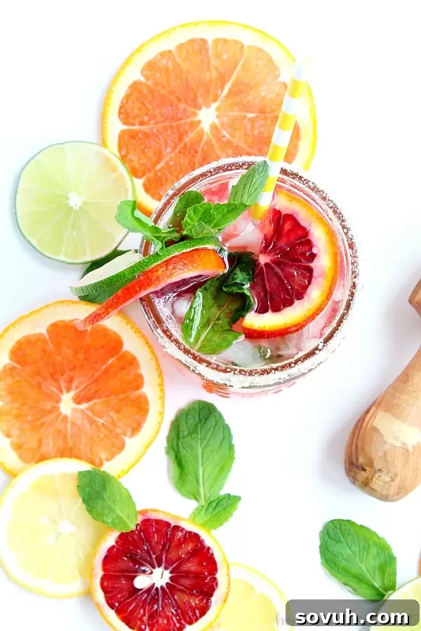 Blood oranges and a little mint make this Blood Orange Mojito beautiful and delicious. I’ll be enjoying this easy mojito recipe all summer long. I might even try something different and make this my Cinco de Mayo drink!