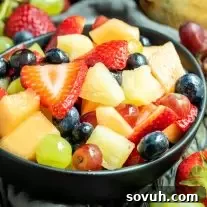 Lemonade Fruit Salad in a black bowl