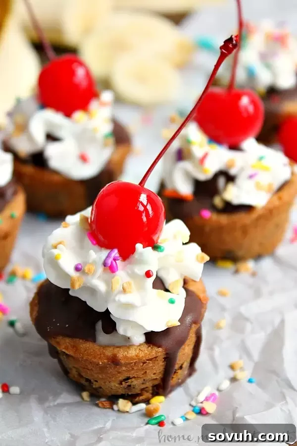 These easy banana split cookie cups are perfect for summer parties...or just a fun dessert for your family! Delicious cookie dough baked into cups and filled with chocolate, banana slices, whipped cream and of course a cherry on top. Who needs a plain old sundae when they could have a banana sundae cookie cup!