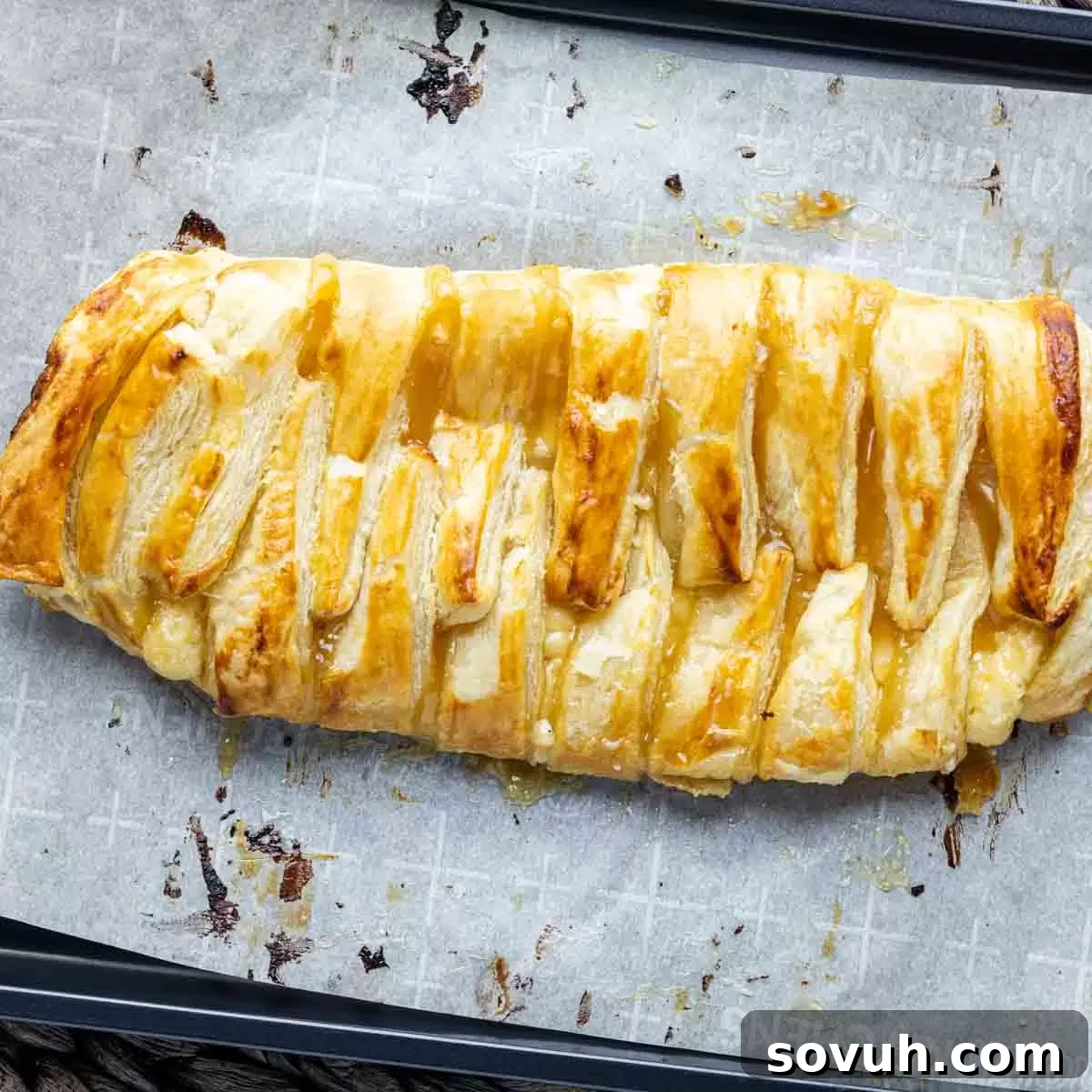 Lemon Cream Cheese Danish on parchment paper and baking sheet