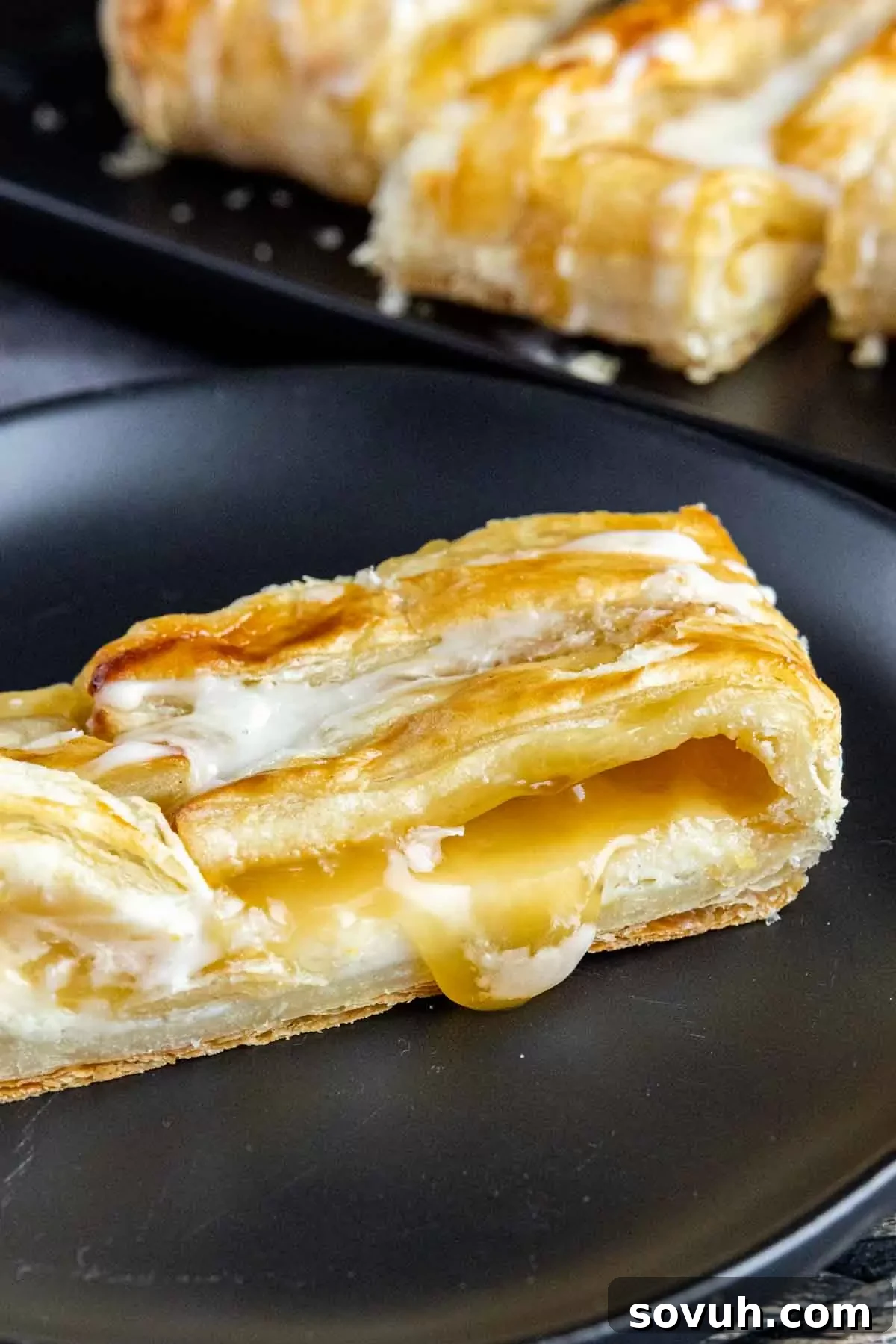Lemon Cream Cheese Danish on a black plate