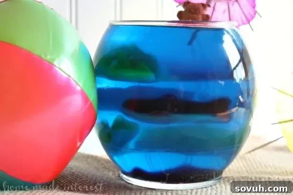 Get ready for Shark Week or celebrate a Shark birthday party with these fun Shark Jell-O bowls filled with gummy sharks! This is a great summer snack for kids!