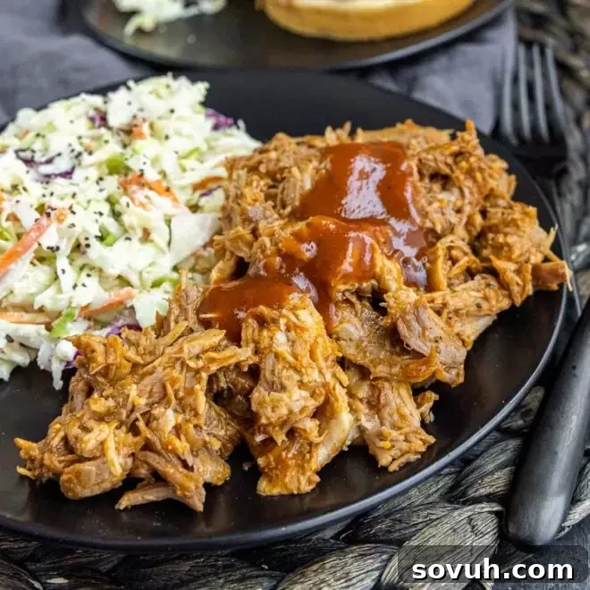 black plate with Slow Cooker BBQ Pulled Pork and coleslaw