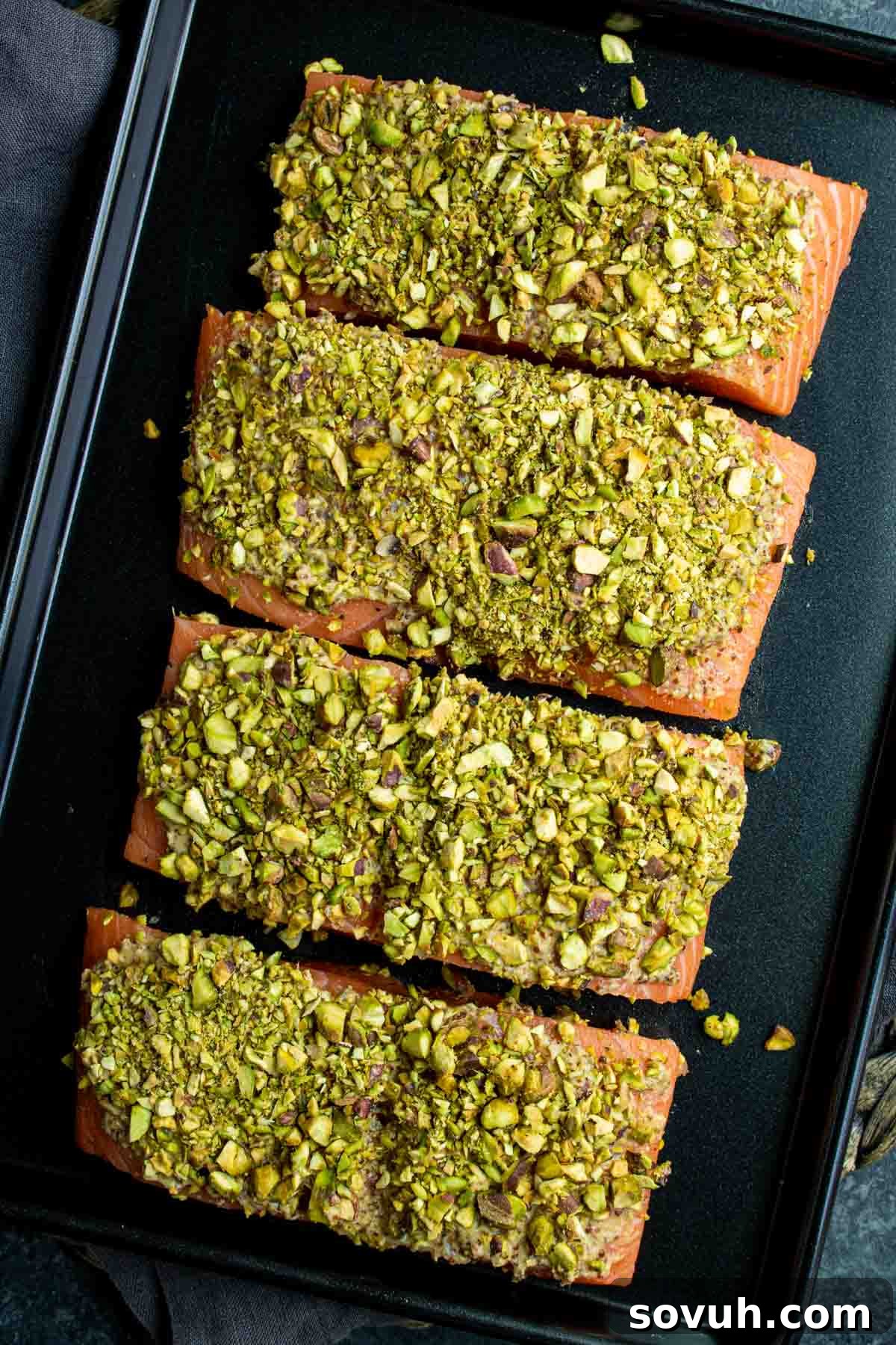 raw Pistachio crusted salmon on sheet pan