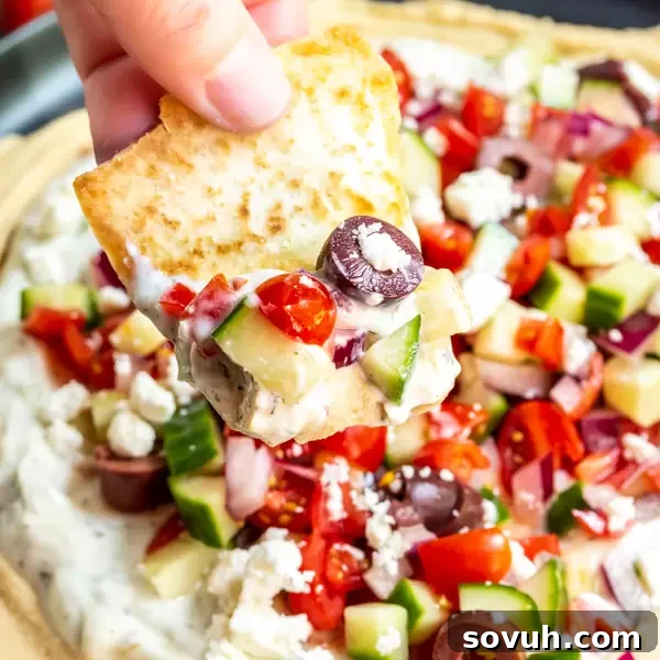 Pita with 5 Layer Greek Dip - a vibrant appetizer with hummus, tzatziki, cucumber tomato salad, feta, and olives