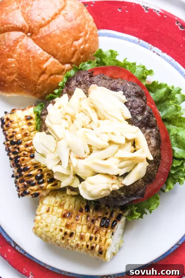 A fully assembled Chesapeake Crab Burger, generously topped with lump crab meat, ready to be served.