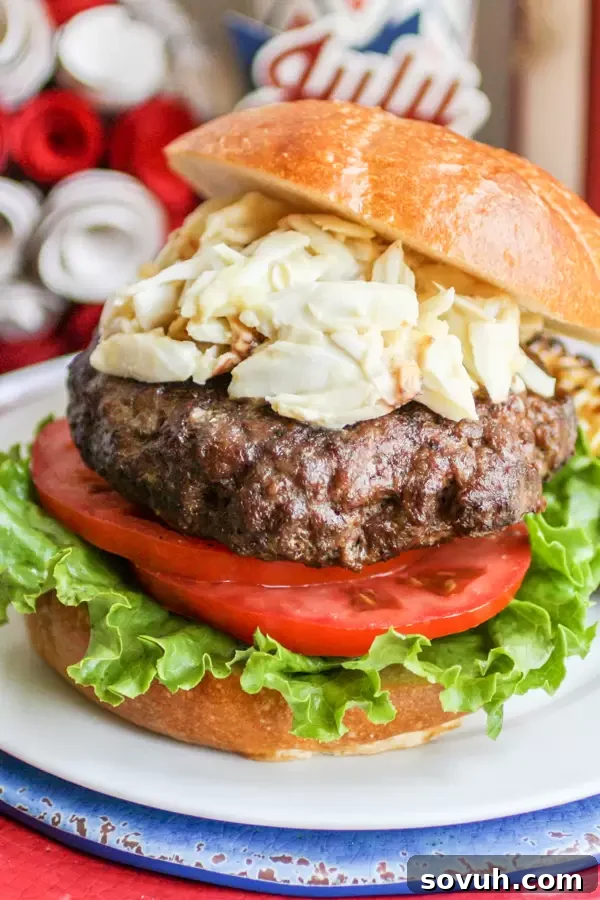 The Chesapeake Crab Burger displayed on a rustic wooden board, perfect for Memorial Day or any summer gathering.