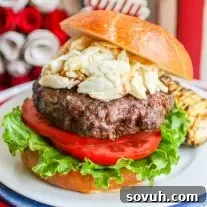 Chesapeake Crab burger on a bun with lettuce and tomato