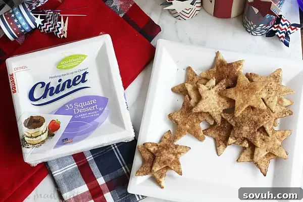 Close-up of fresh Summer Fruit Salsa and star-shaped cinnamon chips, ready to be served at a lively cookout party, emphasizing fresh ingredients.