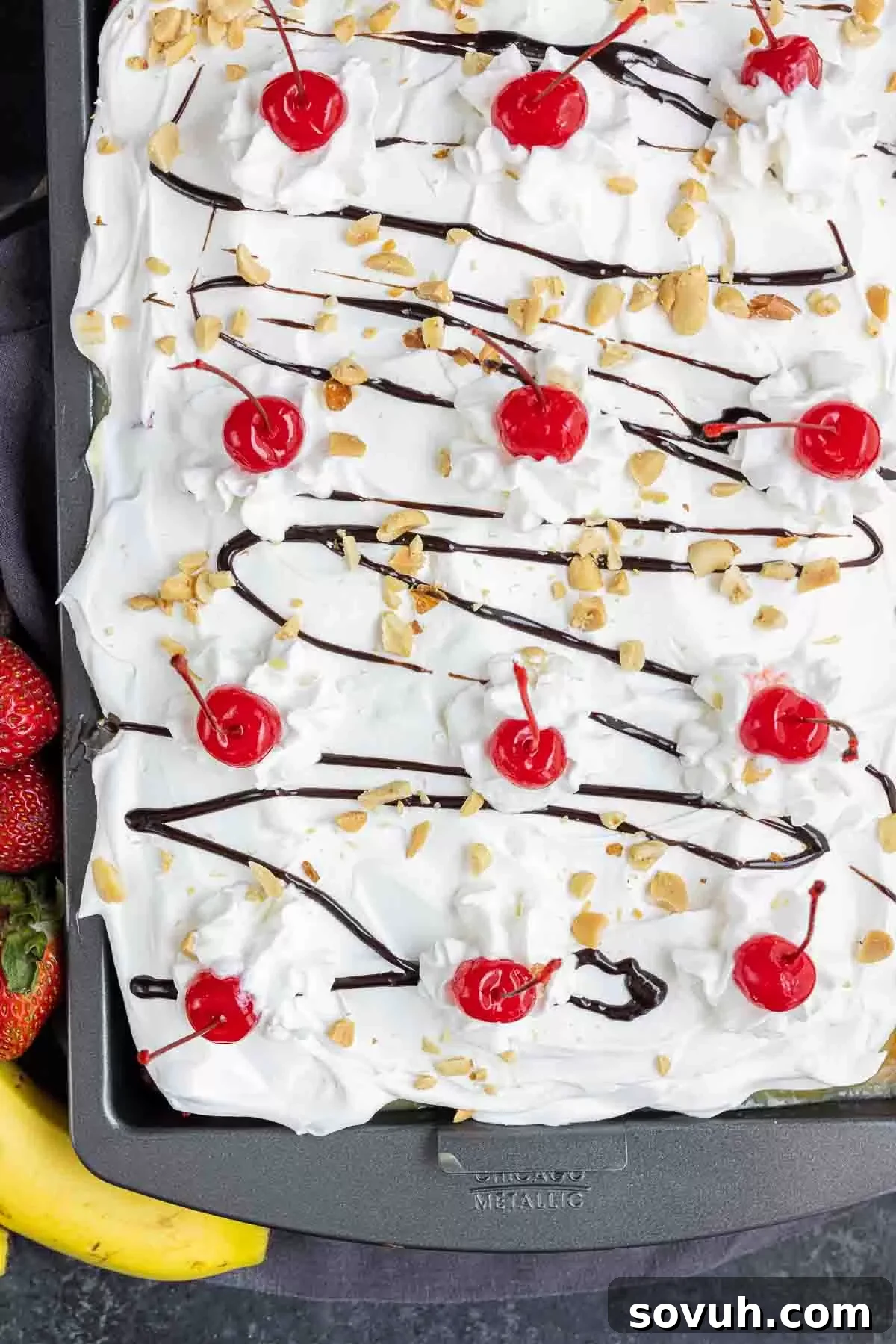 Banana Split Cake topped with cherries